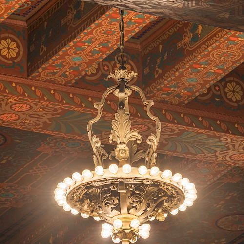 From the gilded ceilings of the main theatre hang the Bonstelle's original chandeliers in the Beaux Arts style.