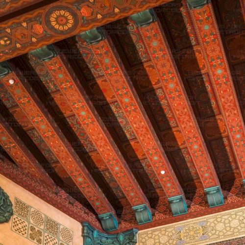 The hand-painted gilded ceilings of red, gold, cream, and green patina highlight the spectacular architecture throughout the main theatre.