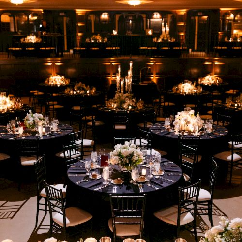 Formal seated dinner space for up to 300 guests highlighted by stunning floral arrangements and candle scapes.